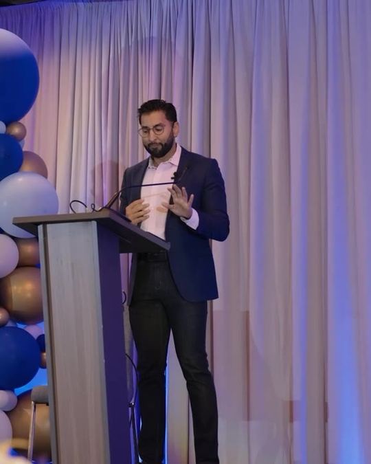Dr. Jamil Jivraj speaking on stage